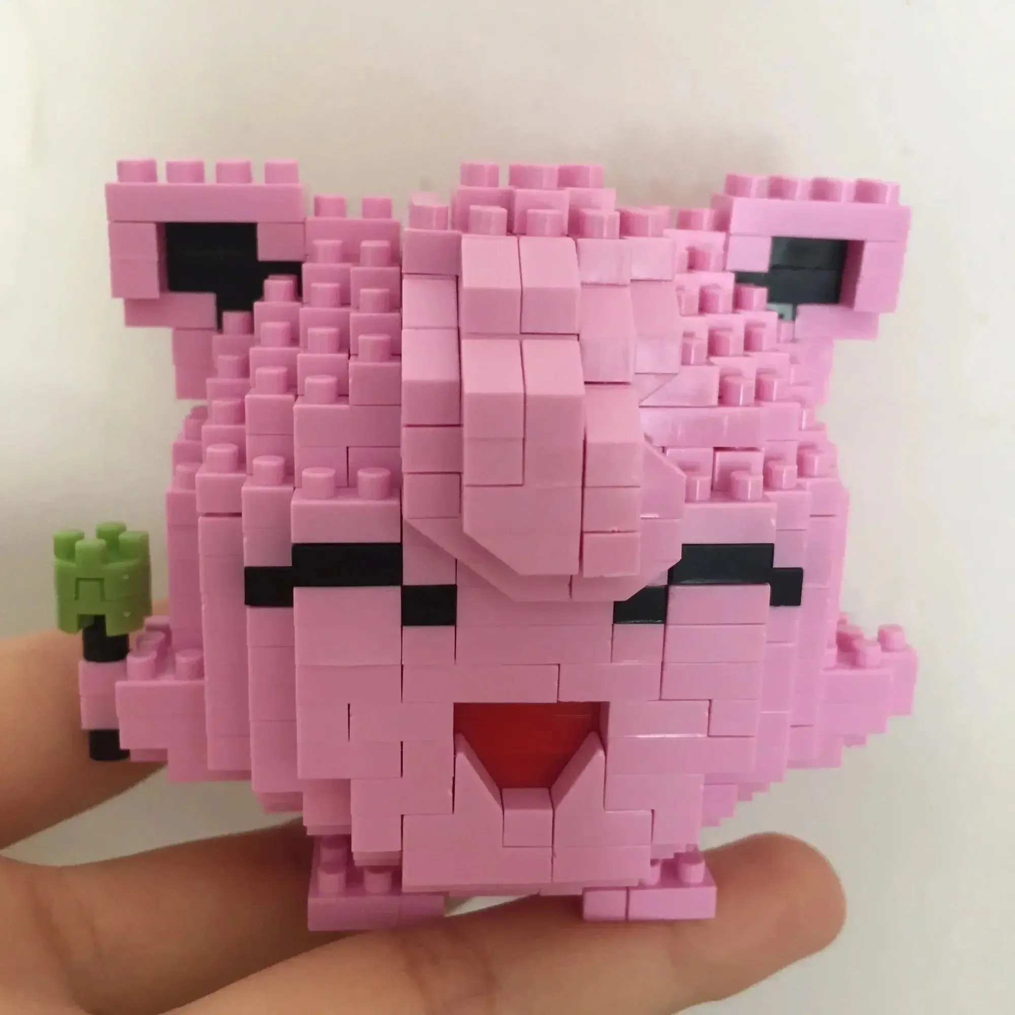 Pokemon Small Blocks Nanoblocks, featuring models of Charizard, Kyogre, Groudon, and Rayquaza, are educational and visually engaging toys, ideal for children's birthday presents.